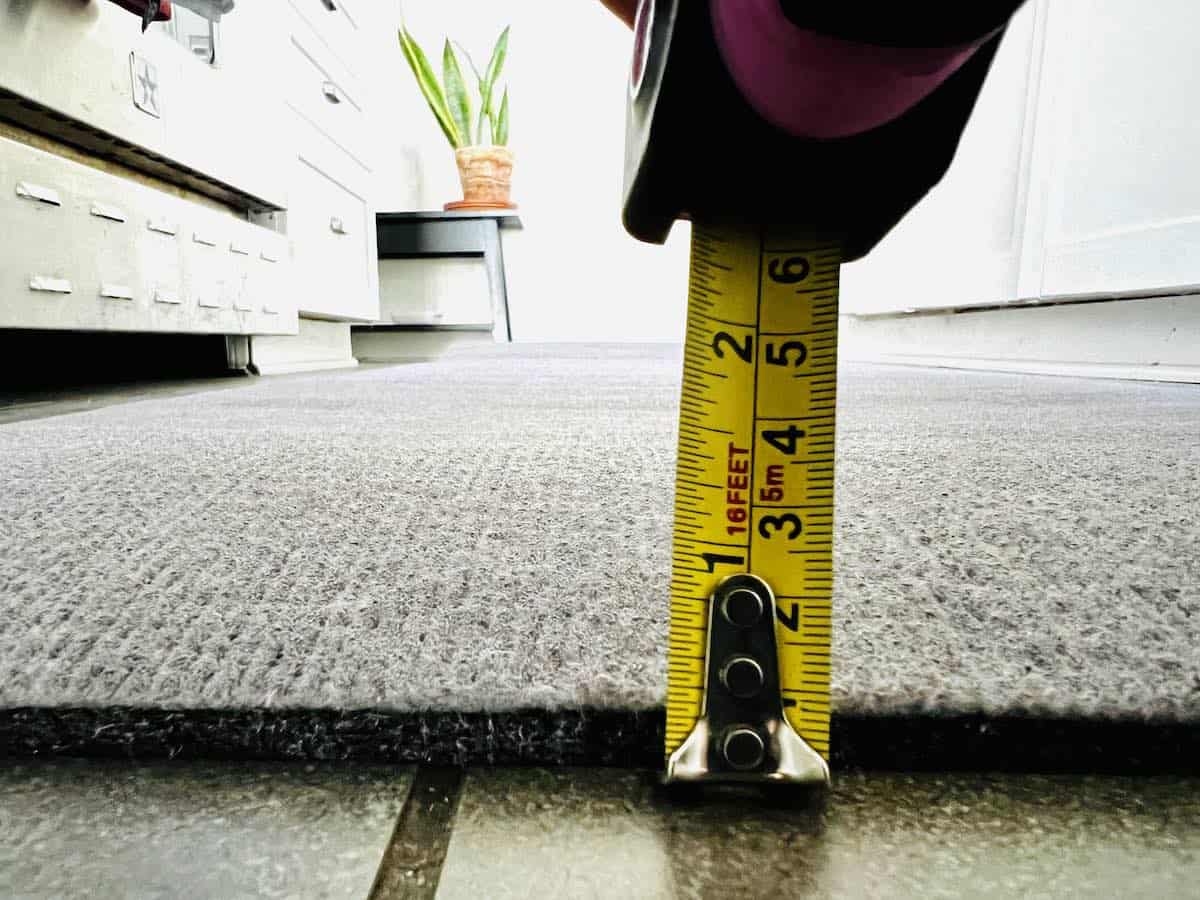 This is a picture of tape measure and ruggable cushioned pad to show thickness.