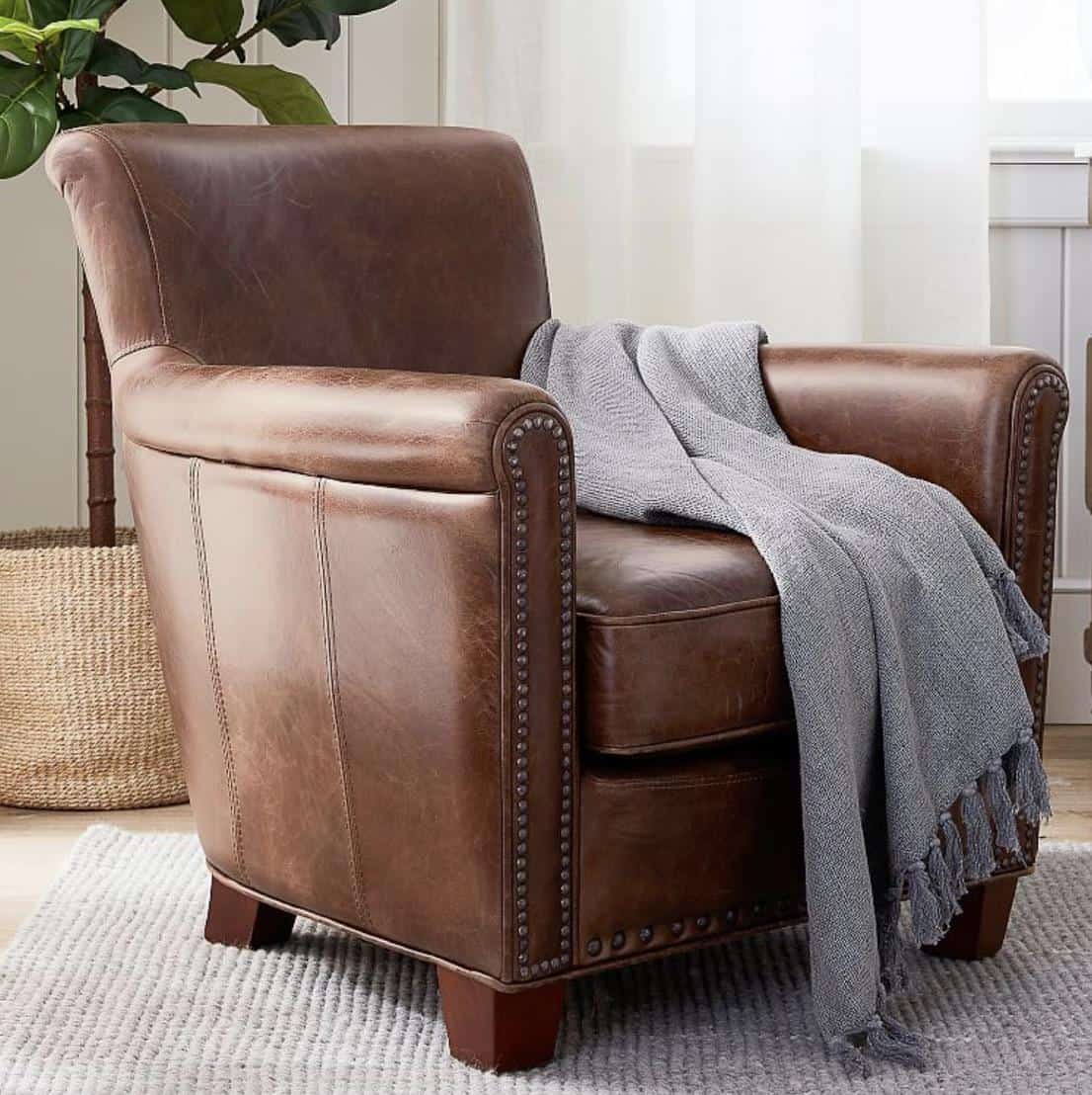 Brown leather armchair with nail head detail for Ralph Lauren style living room